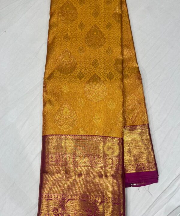 Wedding Special Mustard Yellow Kanjivaram Pattu Saree with Contrast Rani Pink Paisley Pallu